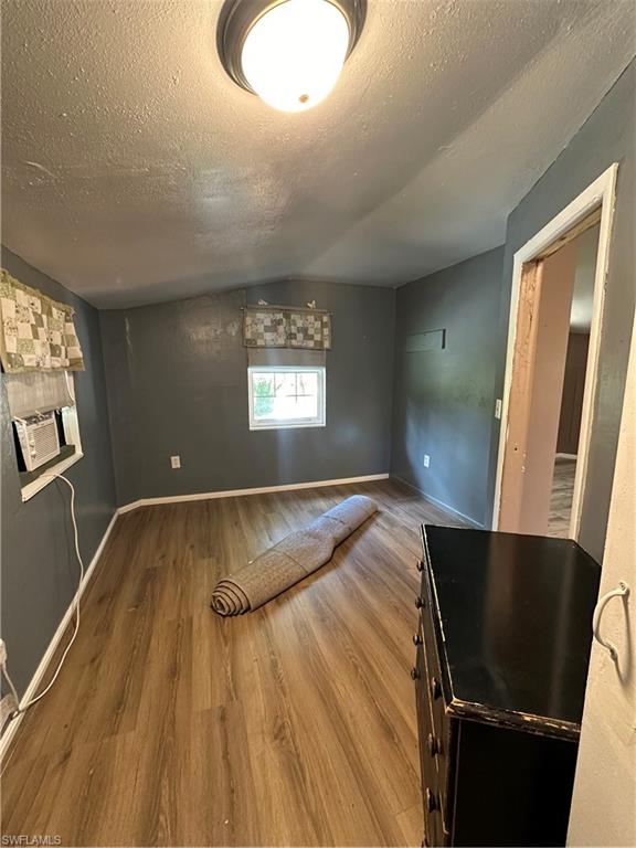 18301 Slater Road North Fort Myers, FL 33917 - Photo 9 of 17 a view of kitchen and dining room with wooden floor