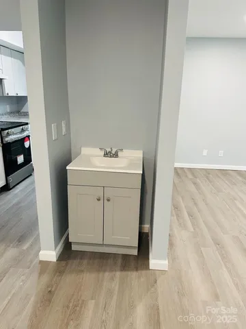 an empty room with wooden floor