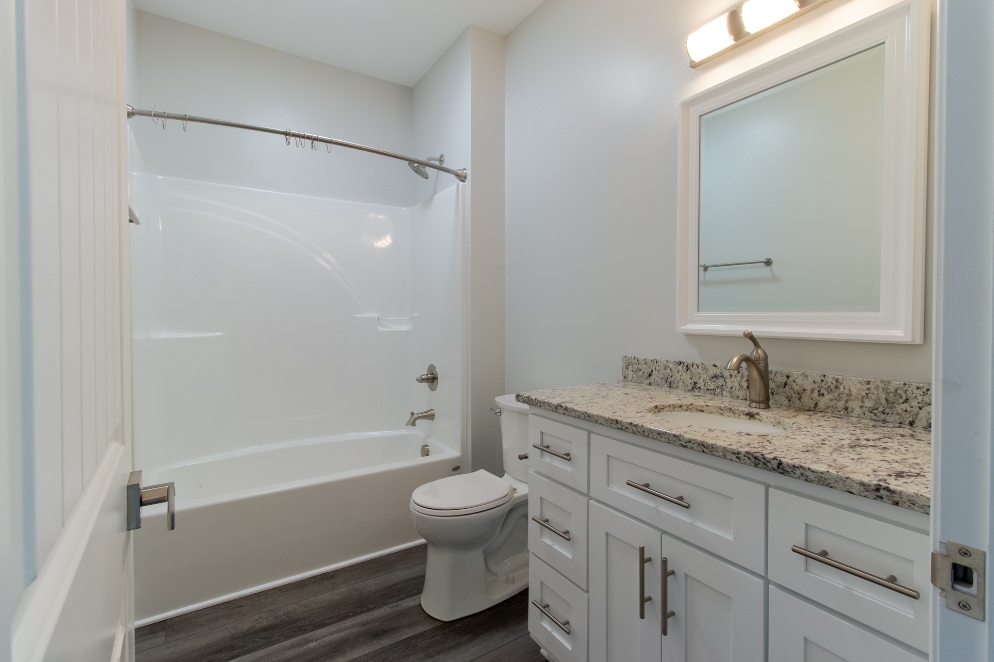 935 South Cross Bridges Road Mount Pleasant, TN 38474 - Photo 24 of 44 a bathroom with a granite countertop sink toilet and shower