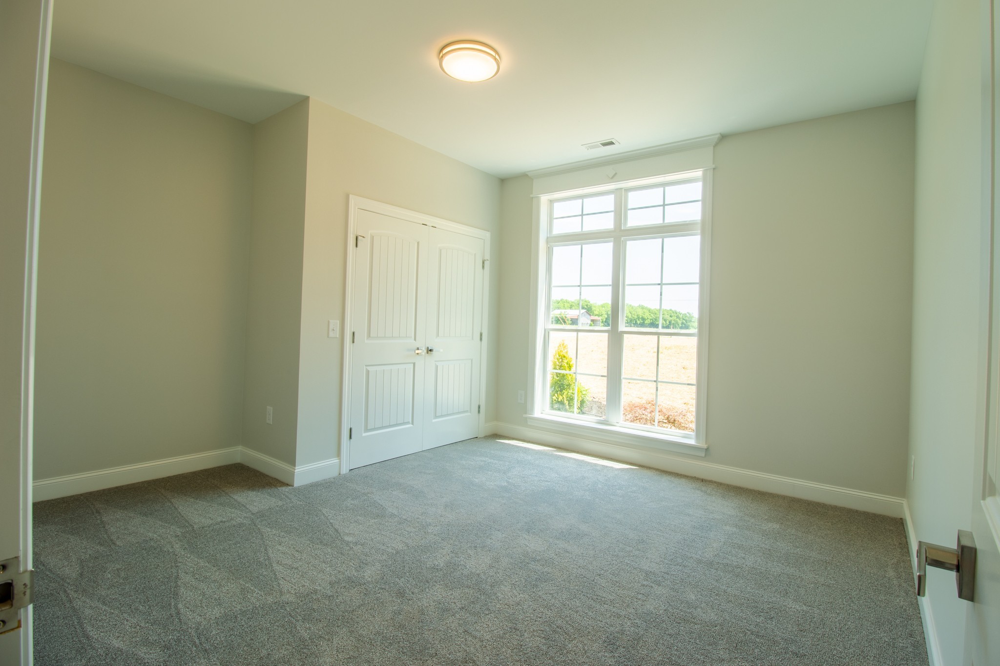 935 South Cross Bridges Road Mount Pleasant, TN 38474 - Photo 27 of 44 an empty room with windows