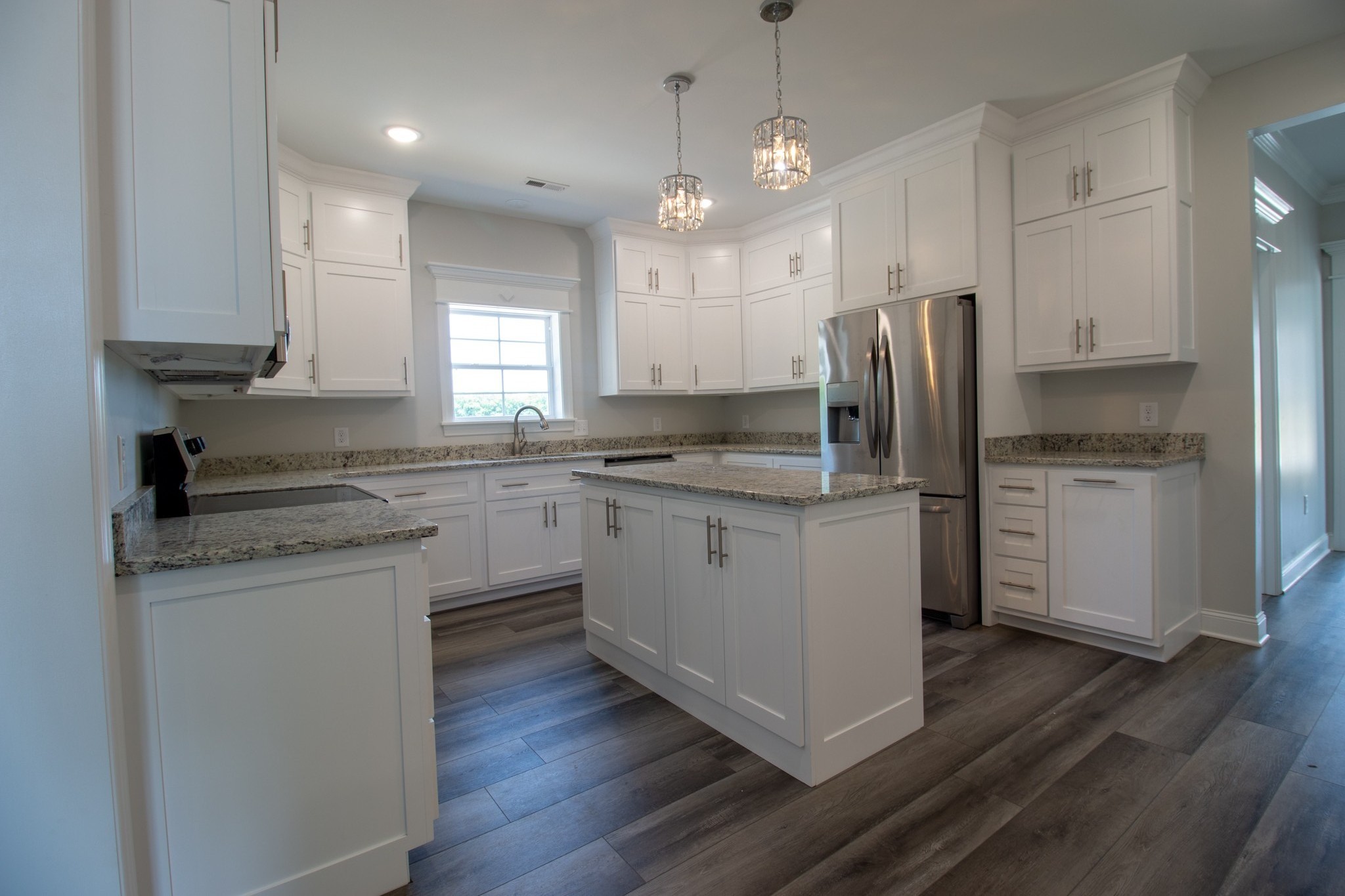935 South Cross Bridges Road Mount Pleasant, TN 38474 - Photo 6 of 44 a kitchen with a sink cabinets stainless steel appliances and a window