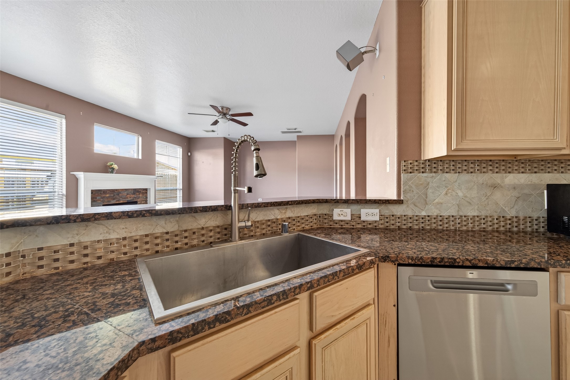 18818 Flagstone Creek Road Houston, TX 77084 - Photo 14 of 47 a kitchen with granite countertop a sink and a stove