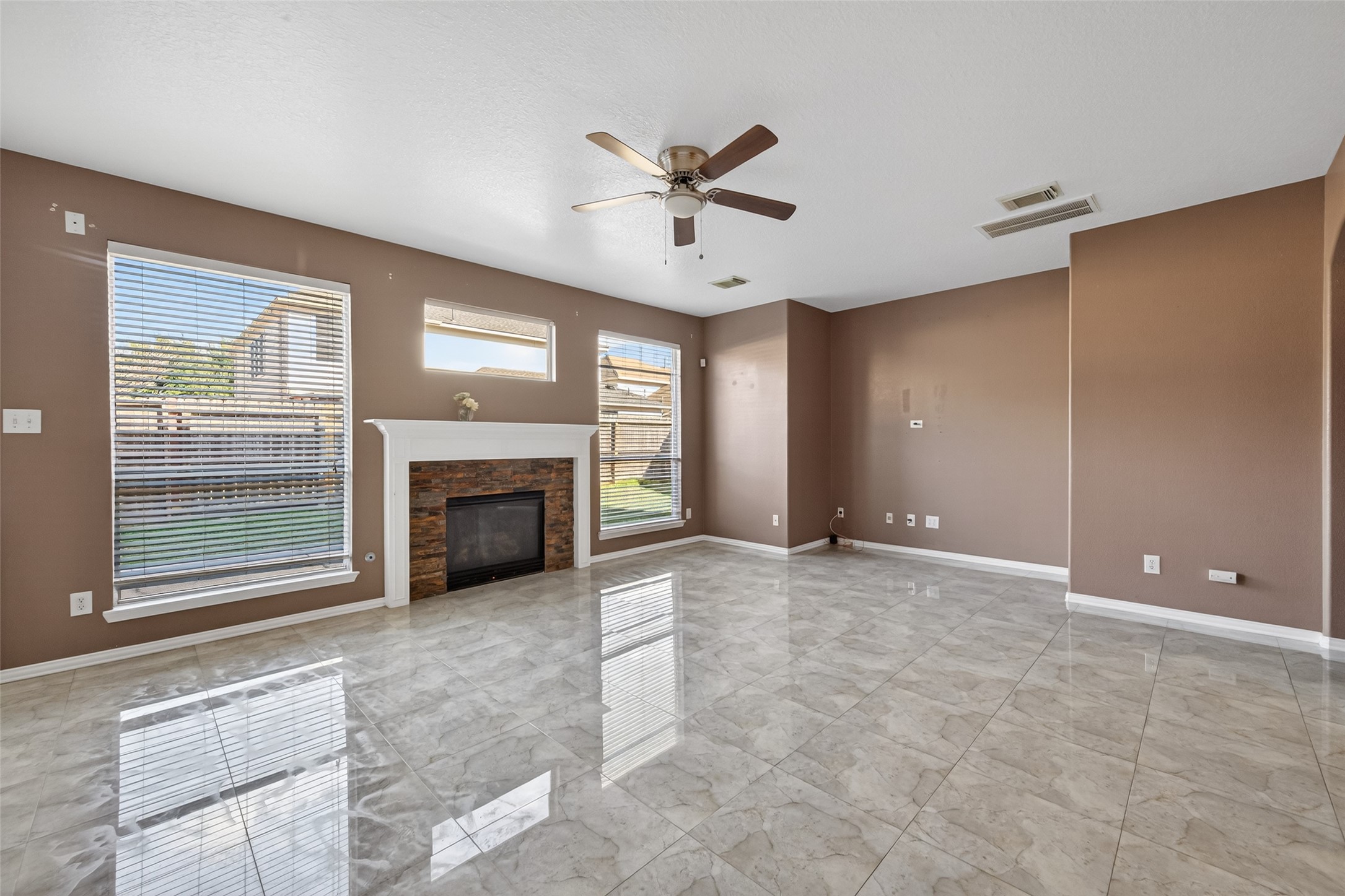 18818 Flagstone Creek Road Houston, TX 77084 - Photo 21 of 47 a view of a livingroom with a fireplace and window