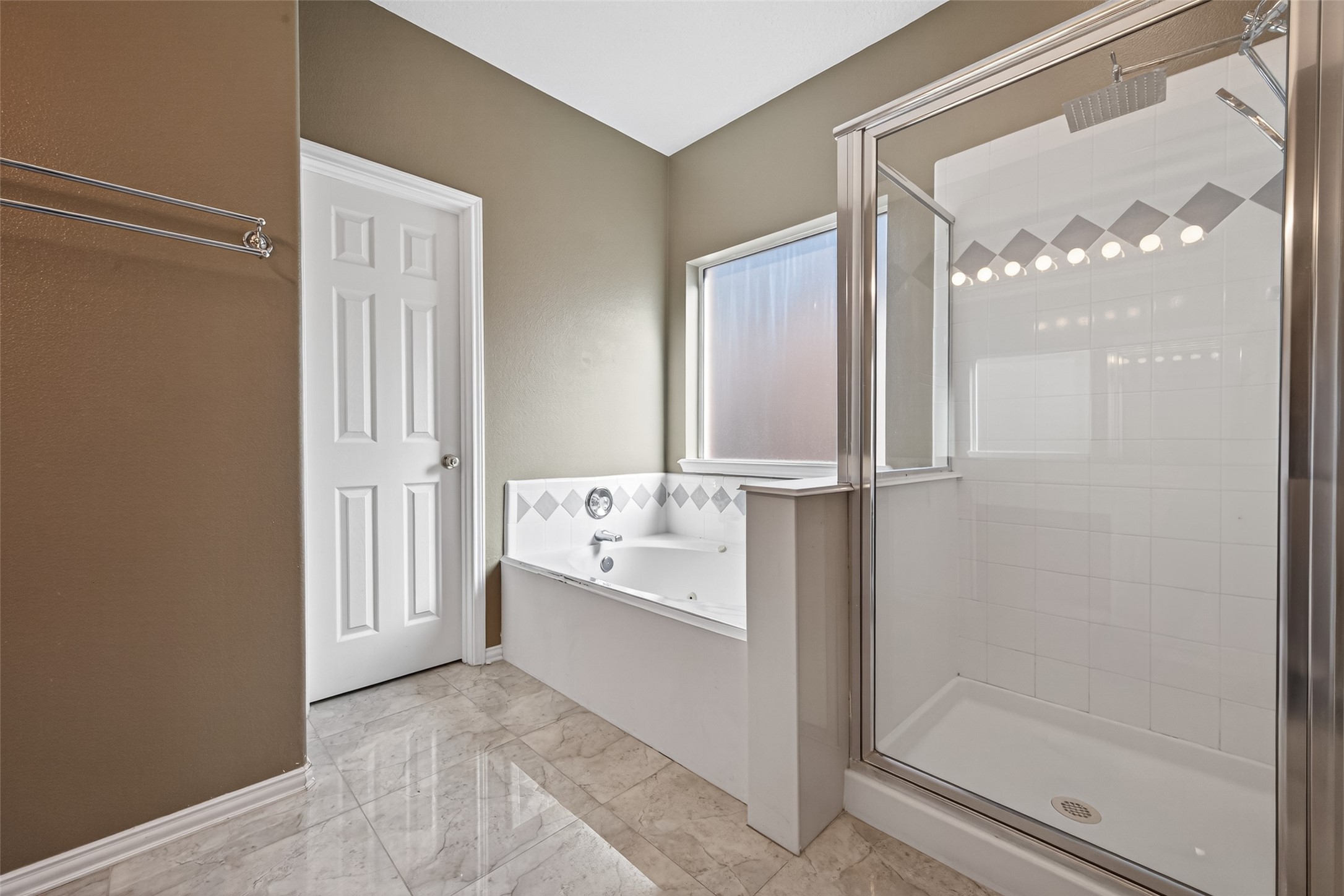 18818 Flagstone Creek Road Houston, TX 77084 - Photo 30 of 47 a bathroom with a tub and shower