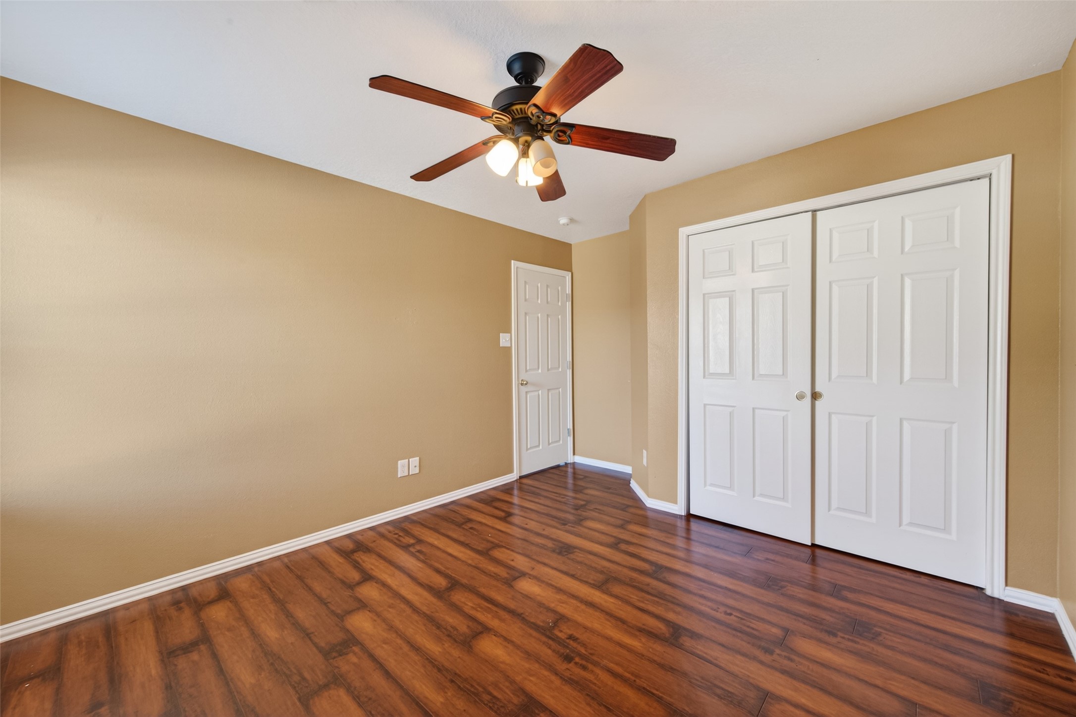 18818 Flagstone Creek Road Houston, TX 77084 - Photo 39 of 47 wooden floor in an empty room with a window