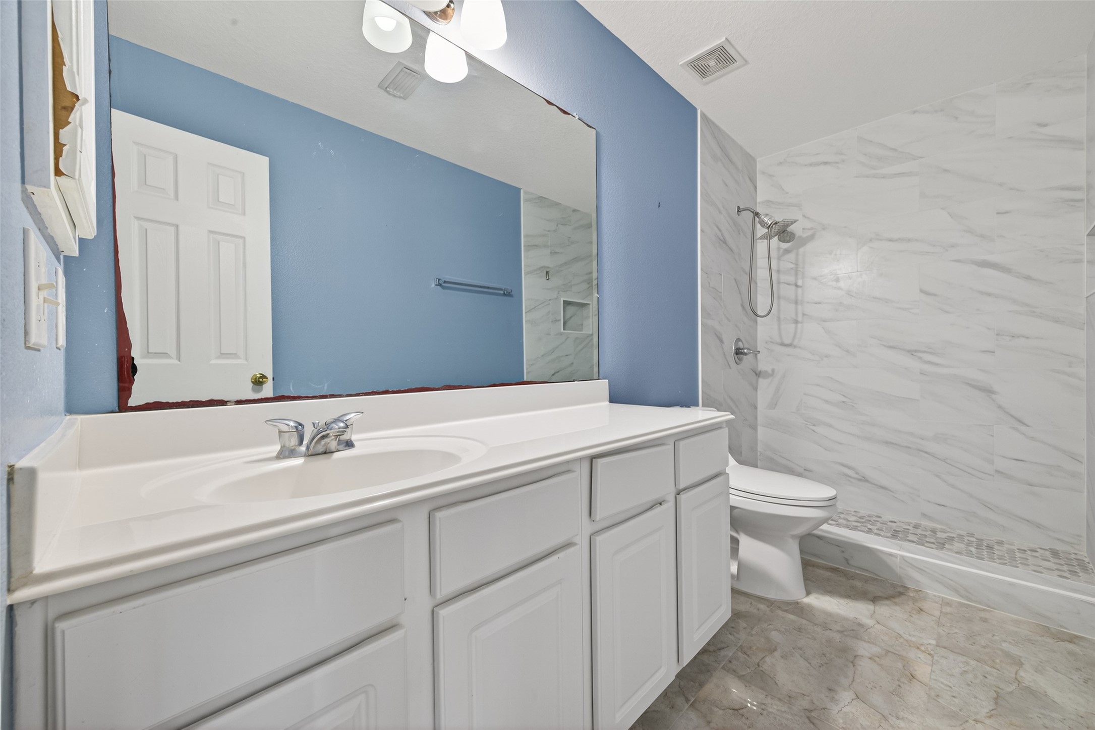 18818 Flagstone Creek Road Houston, TX 77084 - Photo 40 of 47 a bathroom with a sink a toilet and shower