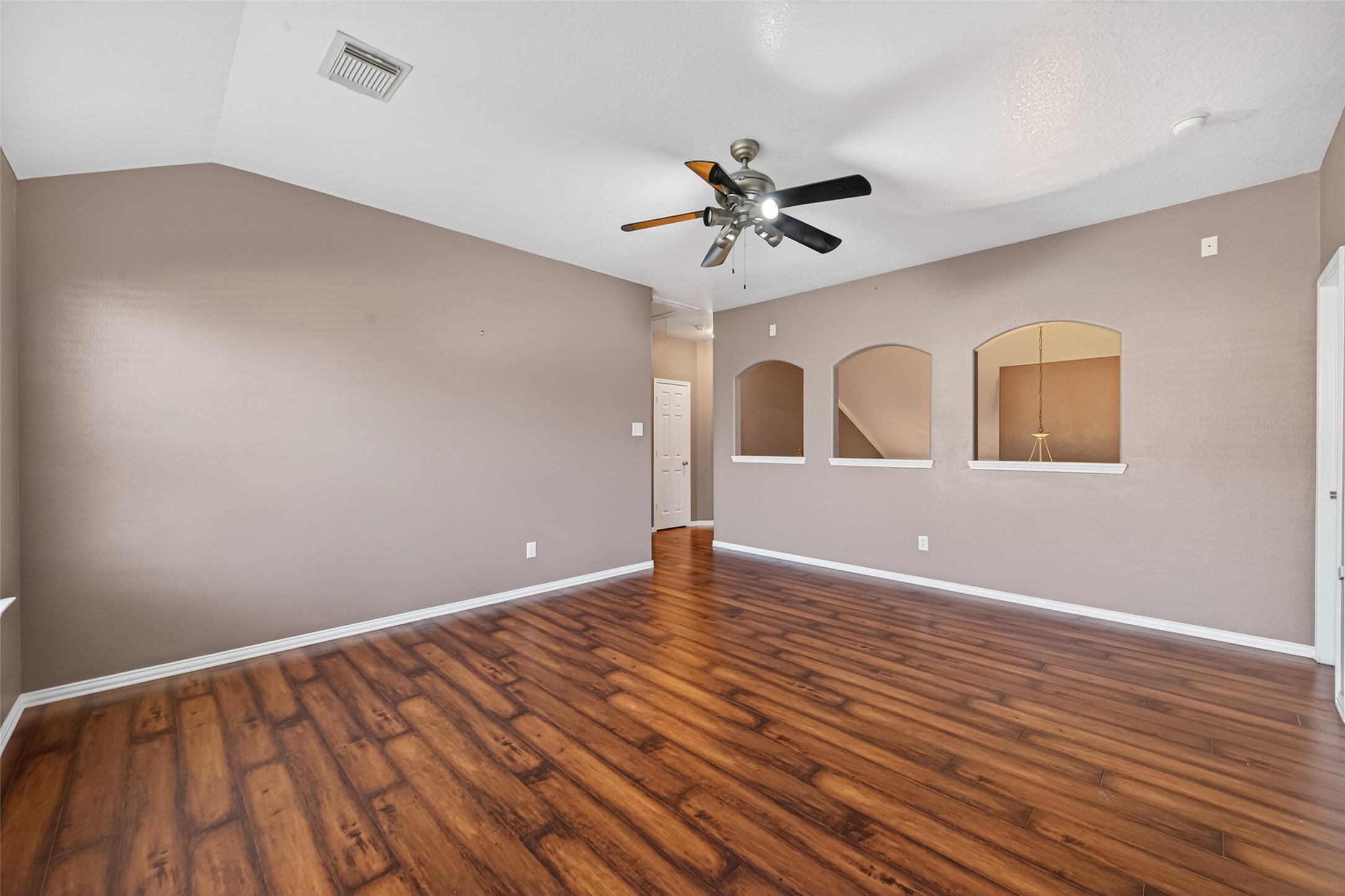 18818 Flagstone Creek Road Houston, TX 77084 - Photo 43 of 47 a view of an empty room with window and wooden floor