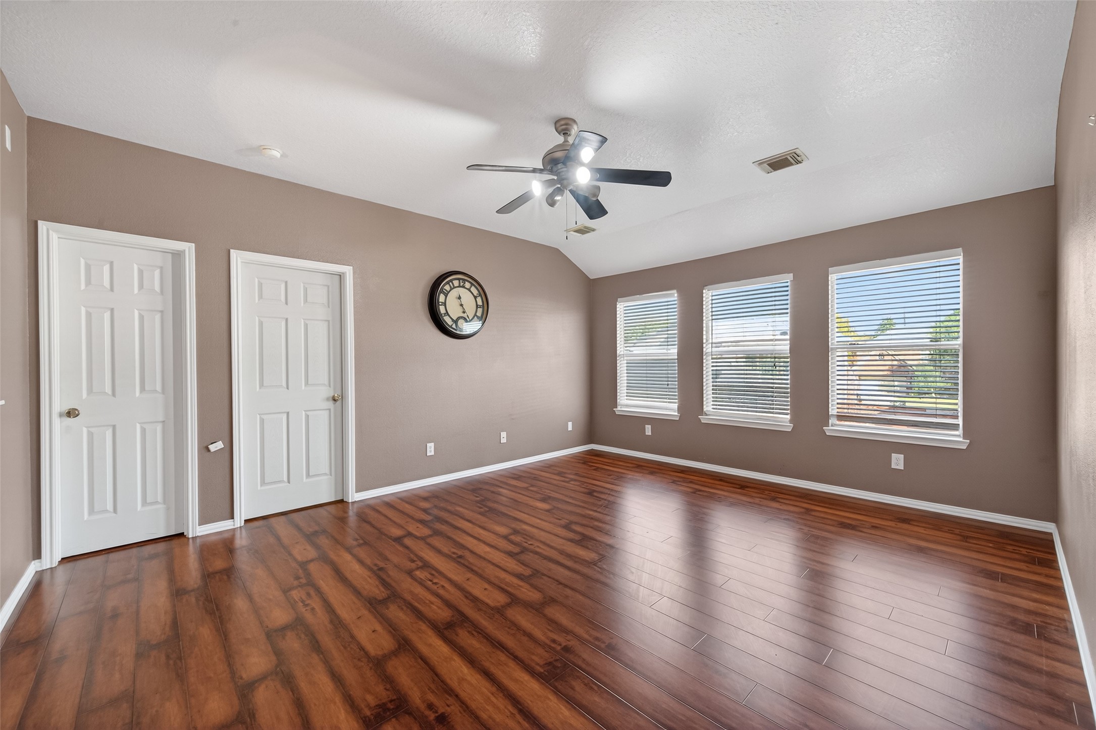 18818 Flagstone Creek Road Houston, TX 77084 - Photo 45 of 47 a view of an empty room with wooden floor and a window