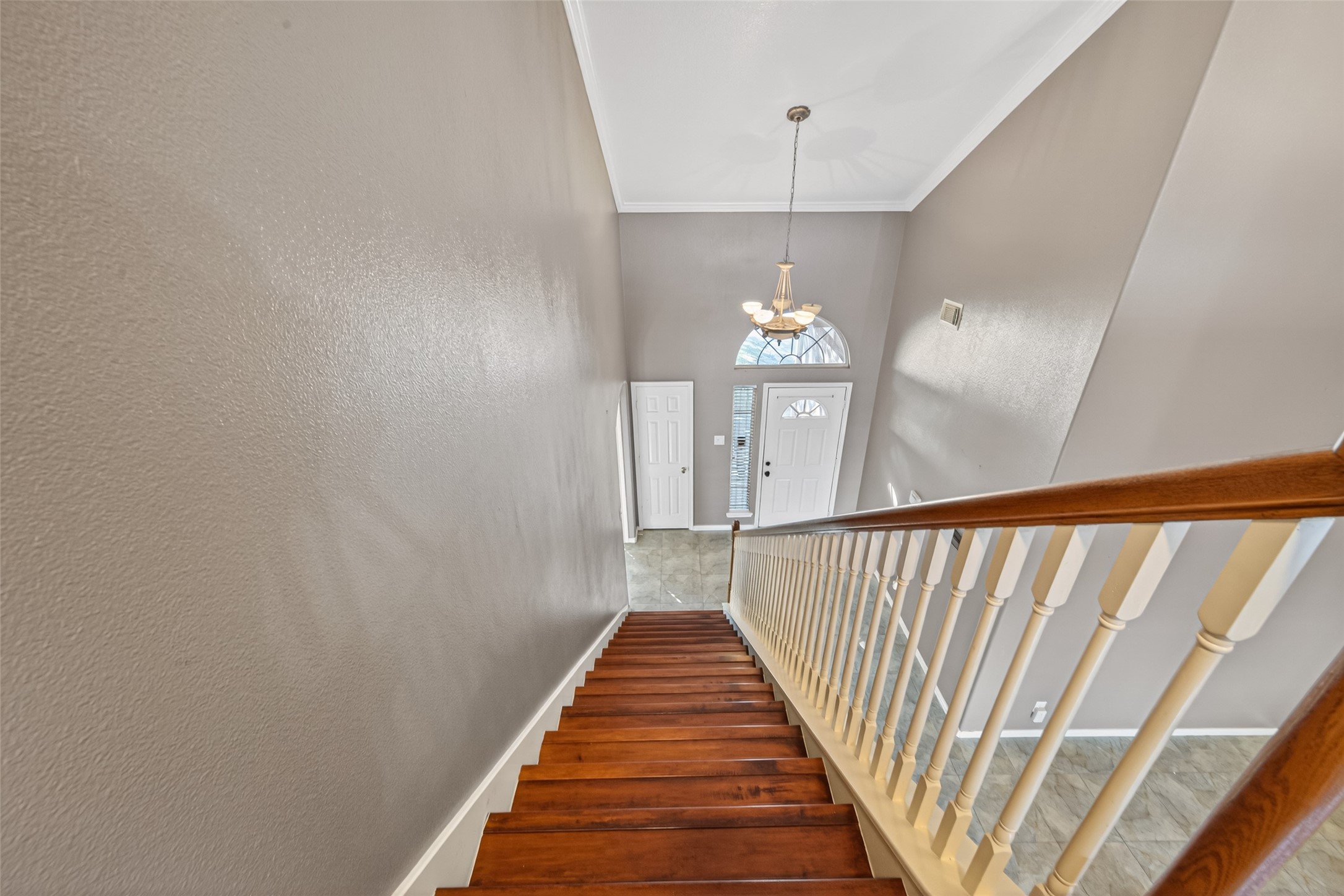 18818 Flagstone Creek Road Houston, TX 77084 - Photo 46 of 47 a view of a hallway with wooden floor and chandelier