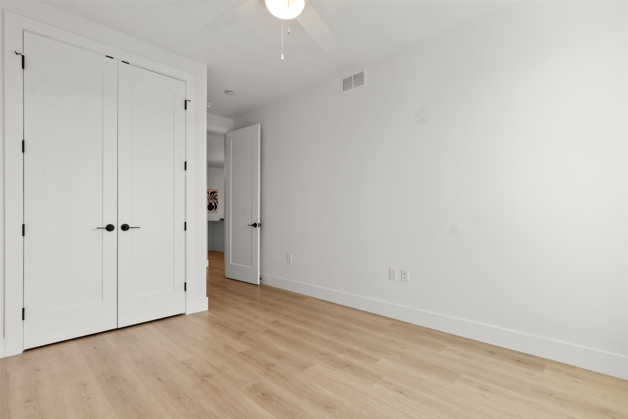 1701 Simond Avenue, Unit 418 Austin, TX 78723 - Photo 20 of 37 Bedroom with light wood-style floors.