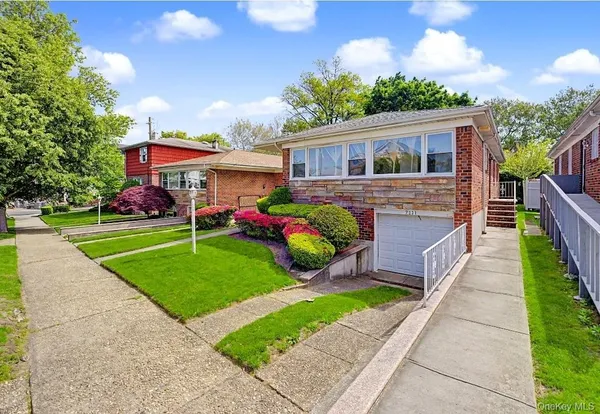 a front view of house with yard and green space