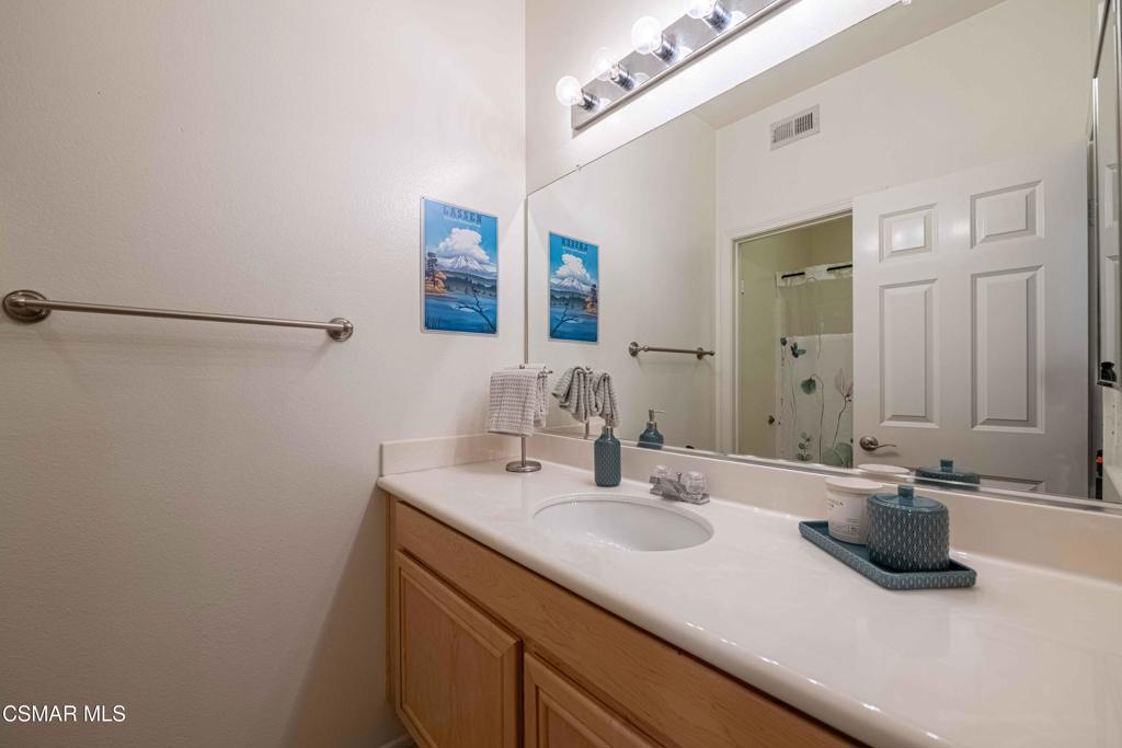 580 Fenwick Way, Unit C Simi Valley, CA 93065 - Photo 32 of 39 a bathroom with a sink and a mirror