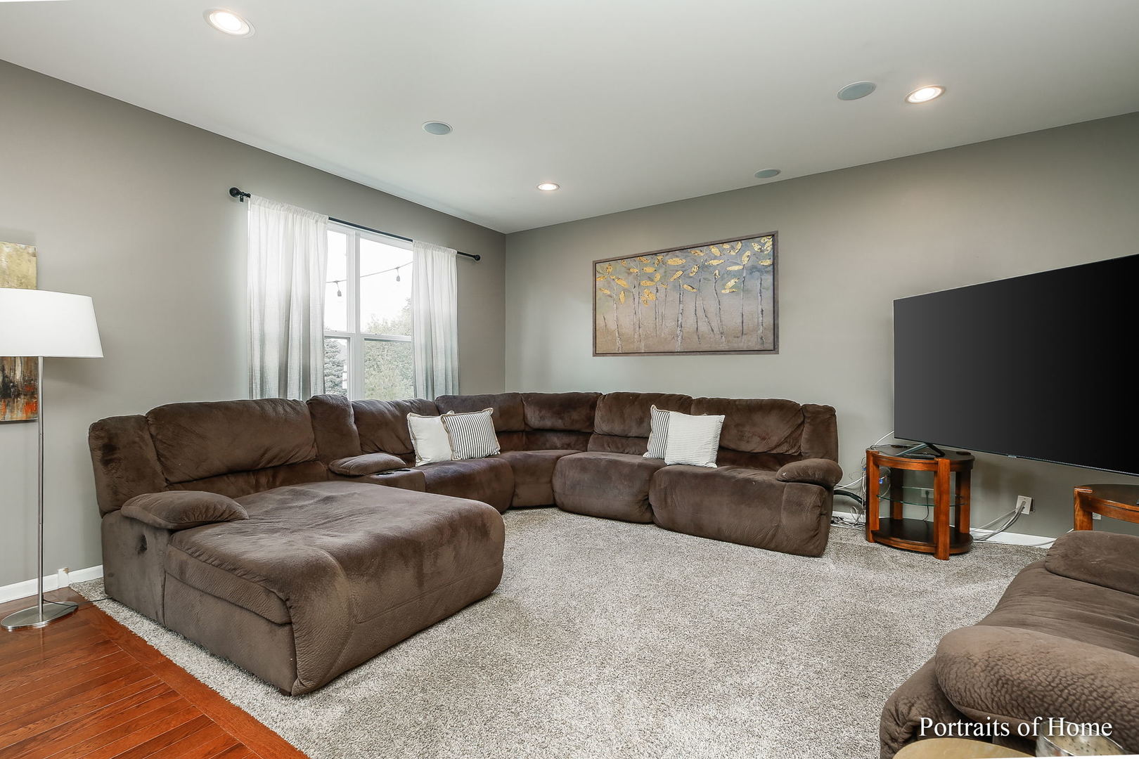 27-w030 Churchill Road Winfield, IL 60190 - Photo 12 of 28 a living room with furniture and a flat screen tv