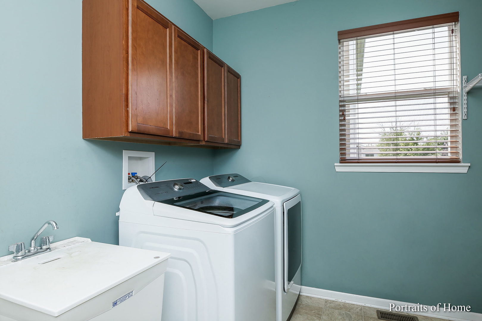 27-w030 Churchill Road Winfield, IL 60190 - Photo 14 of 28 a utility room with sink dryer and washer