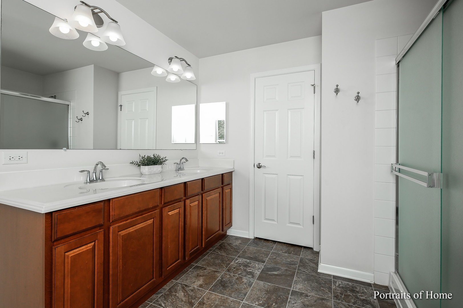 27-w030 Churchill Road Winfield, IL 60190 - Photo 20 of 28 a bathroom with a double vanity sink and a mirror