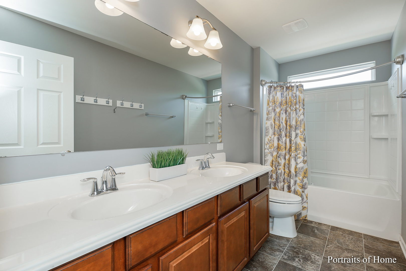 27-w030 Churchill Road Winfield, IL 60190 - Photo 24 of 28 a bathroom with a double vanity sink toilet and shower