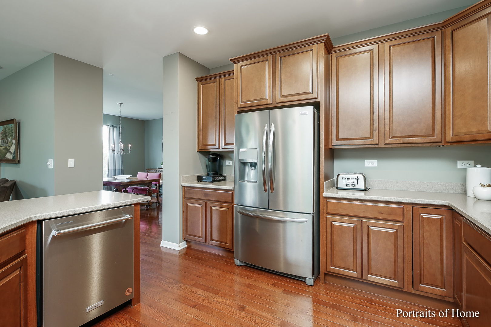 27-w030 Churchill Road Winfield, IL 60190 - Photo 10 of 28 a kitchen with stainless steel appliances granite countertop a refrigerator sink and cabinets