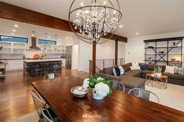 a room with lots of dining table and chairs