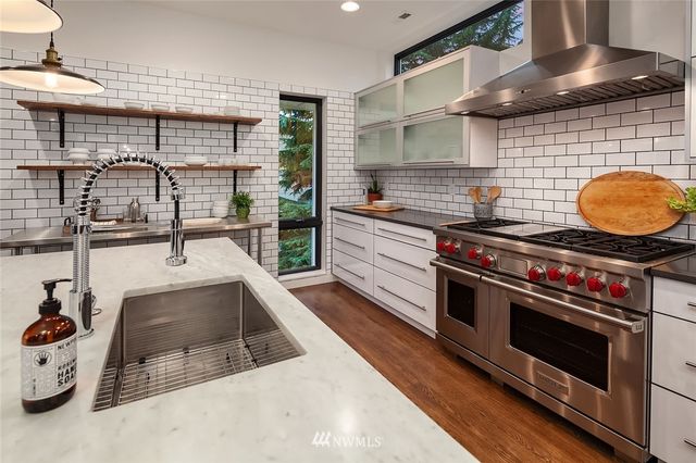 a kitchen with a stove and a sink