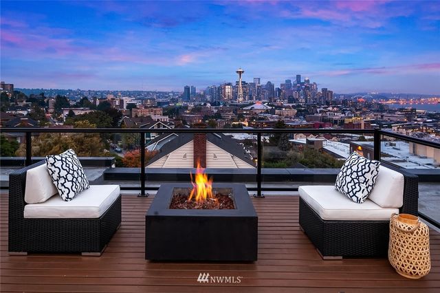 a outdoor living space with furniture and city view