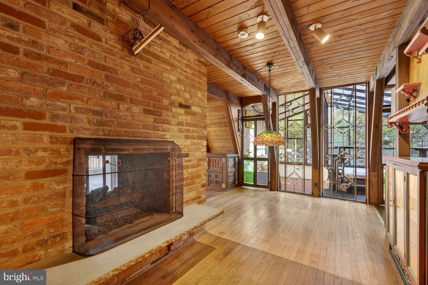 31 Hayward Court Takoma Park, MD 20912 - Photo 15 of 30 a view of a porch with a table and chairs and floor to ceiling window