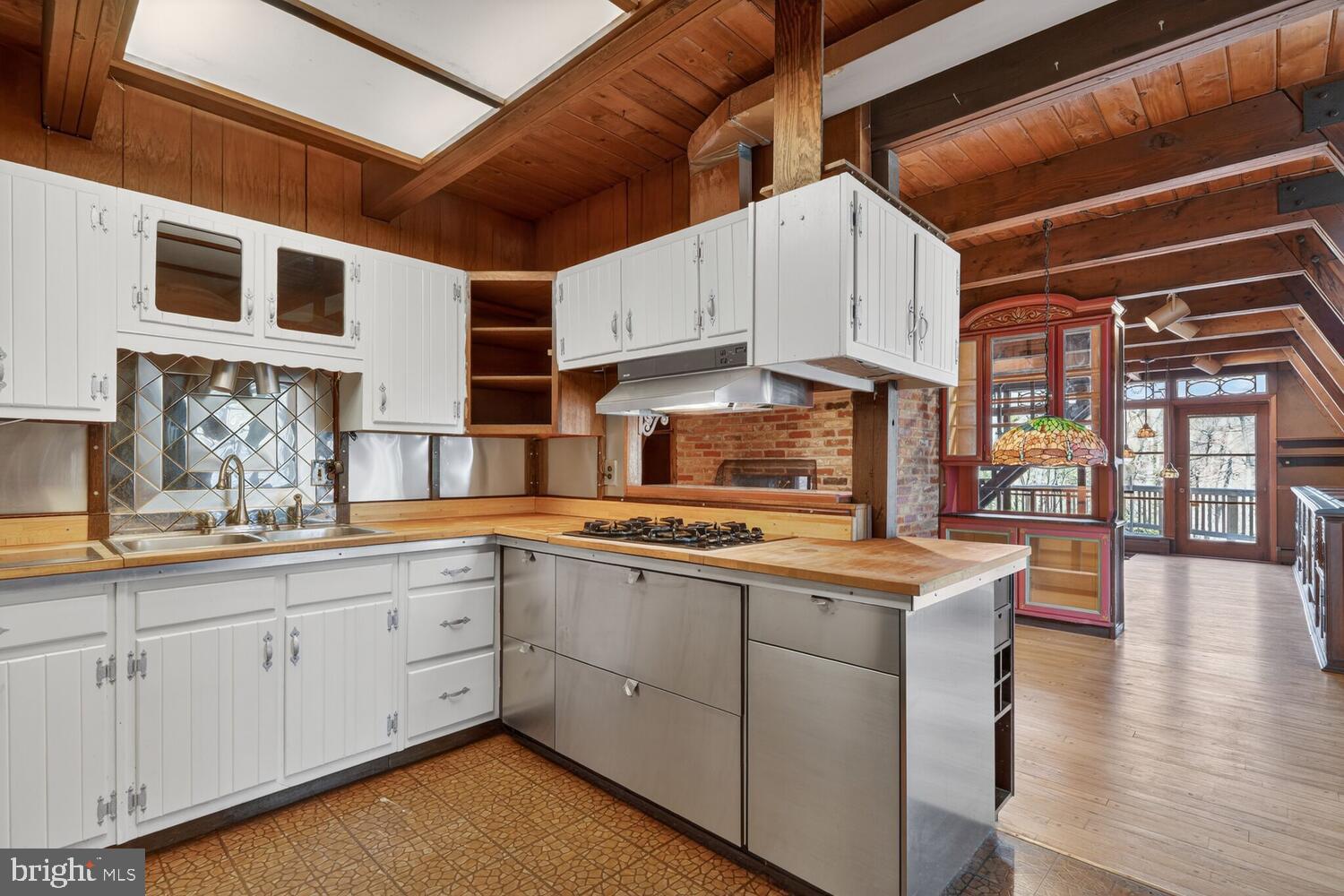 31 Hayward Court Takoma Park, MD 20912 - Photo 17 of 30 a kitchen with cabinets a sink and appliances