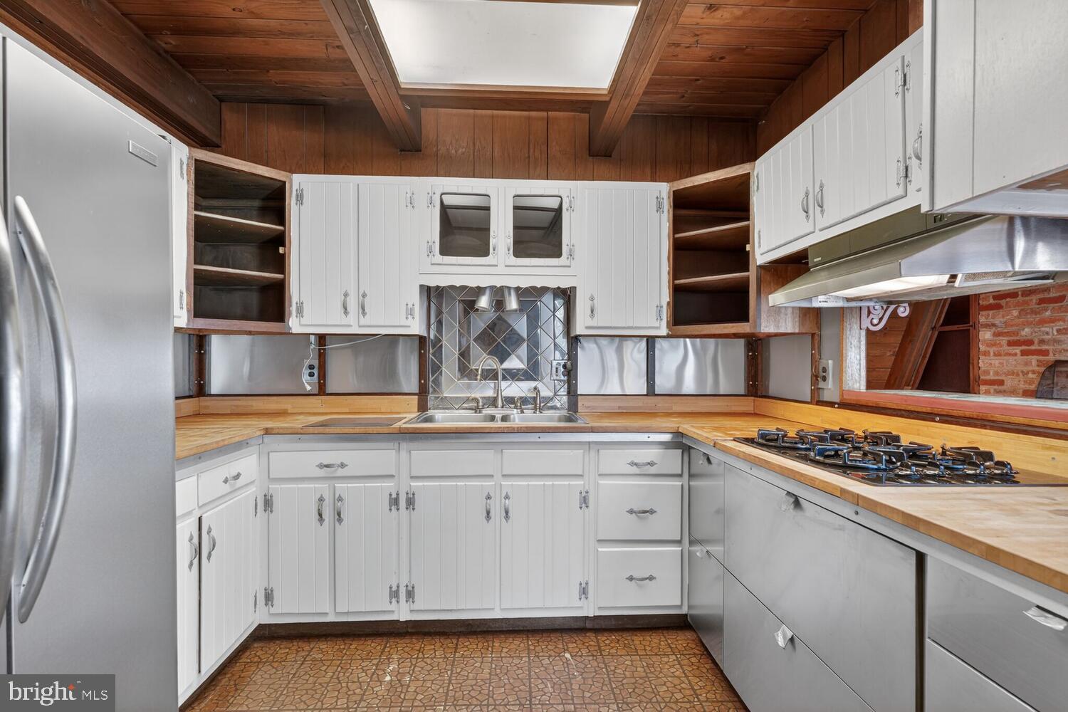 31 Hayward Court Takoma Park, MD 20912 - Photo 18 of 30 a kitchen with stainless steel appliances granite countertop a stove and a sink