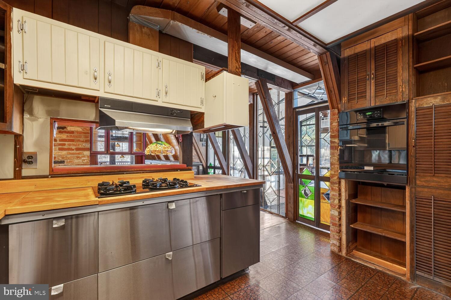 31 Hayward Court Takoma Park, MD 20912 - Photo 19 of 30 a kitchen with stainless steel appliances granite countertop a refrigerator and a stove