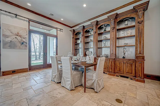 a kitchen with stainless steel appliances granite countertop a sink a stove and a wooden floors