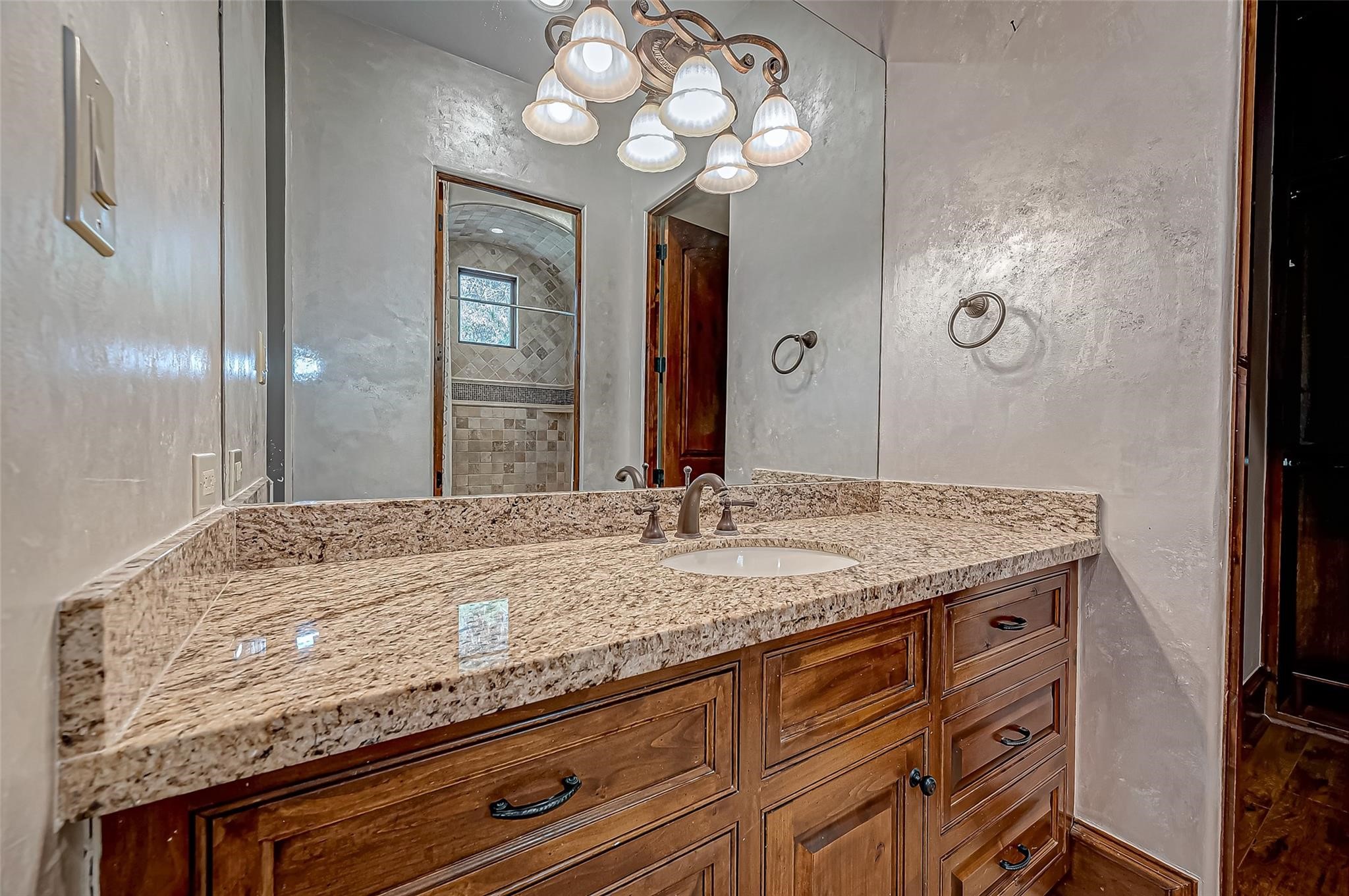 3 Congressional Circle Spring, TX 77389 - Photo 40 of 48 a bathroom with a granite countertop sink and a mirror