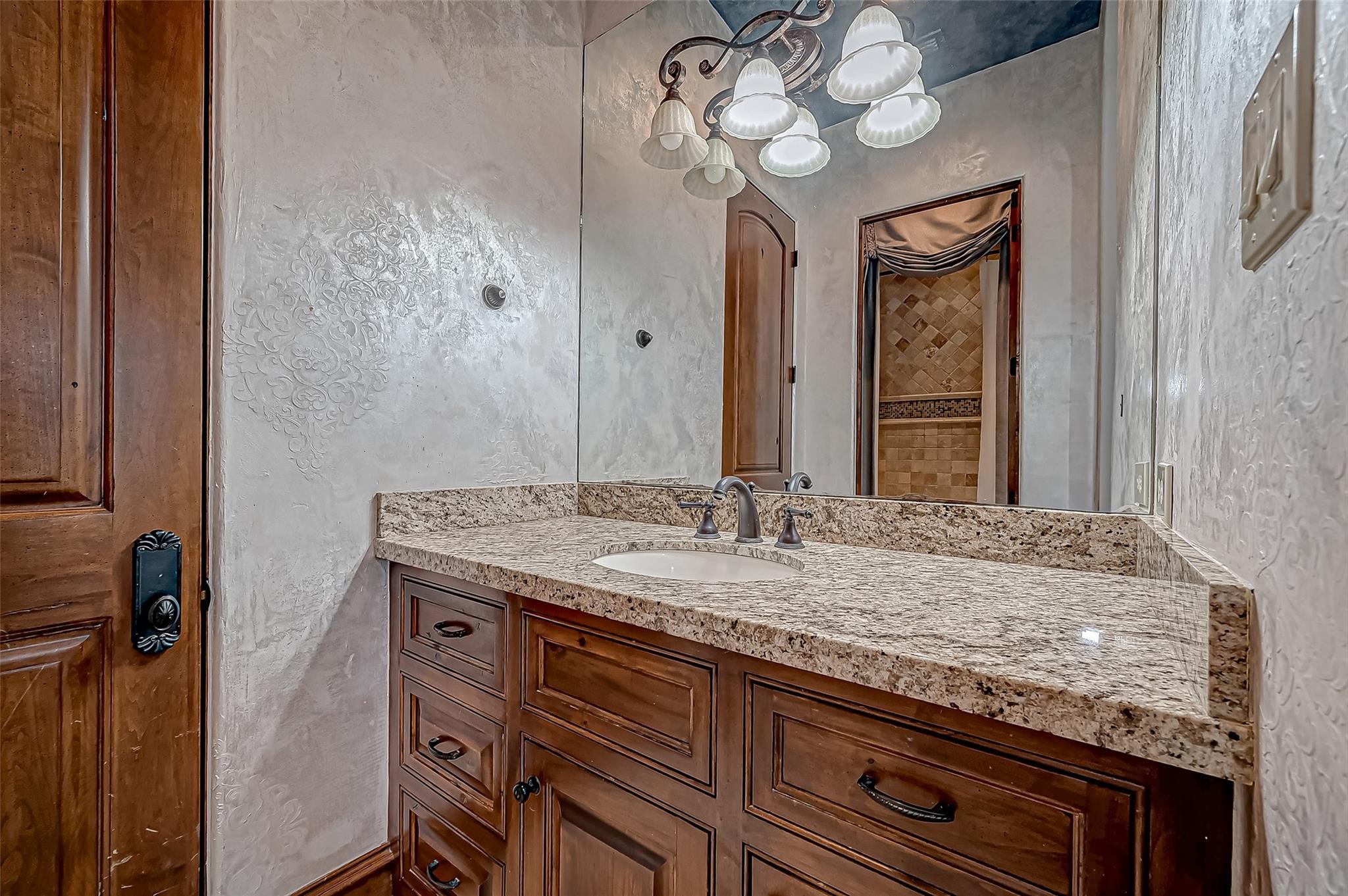 3 Congressional Circle Spring, TX 77389 - Photo 42 of 48 a bathroom with a granite countertop sink and a mirror