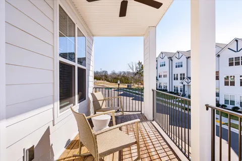 a view of balcony with furniture