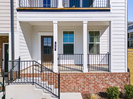 a view of a brick house with a large window