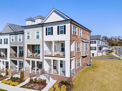 a front view of a house with a swimming pool