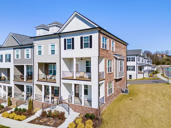a front view of a house with a swimming pool