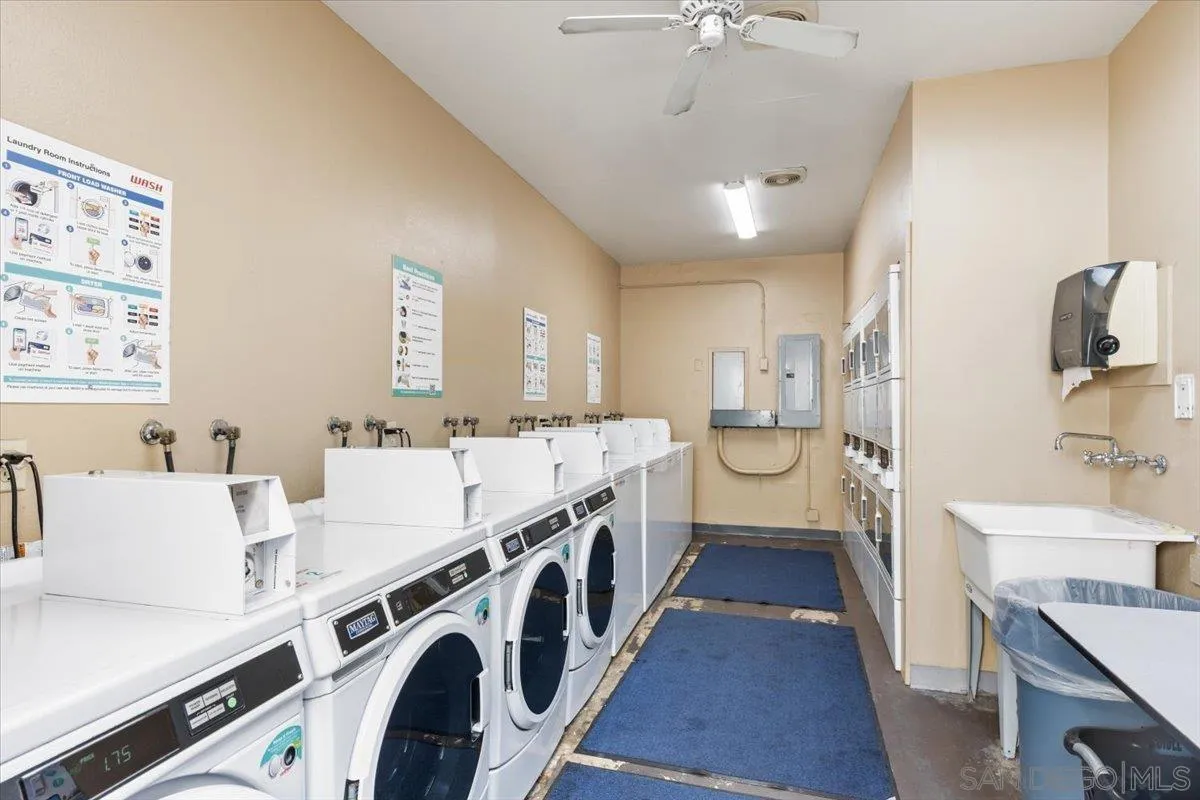 6333 Mt Ada Road, Unit 279 San Diego, CA 92111 - Photo 20 of 21 a large white kitchen with a large window