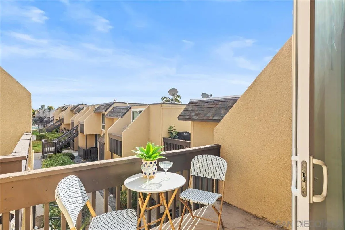 6333 Mt Ada Road, Unit 279 San Diego, CA 92111 - Photo 4 of 21 a view of a dining room with furniture window and wooden floor