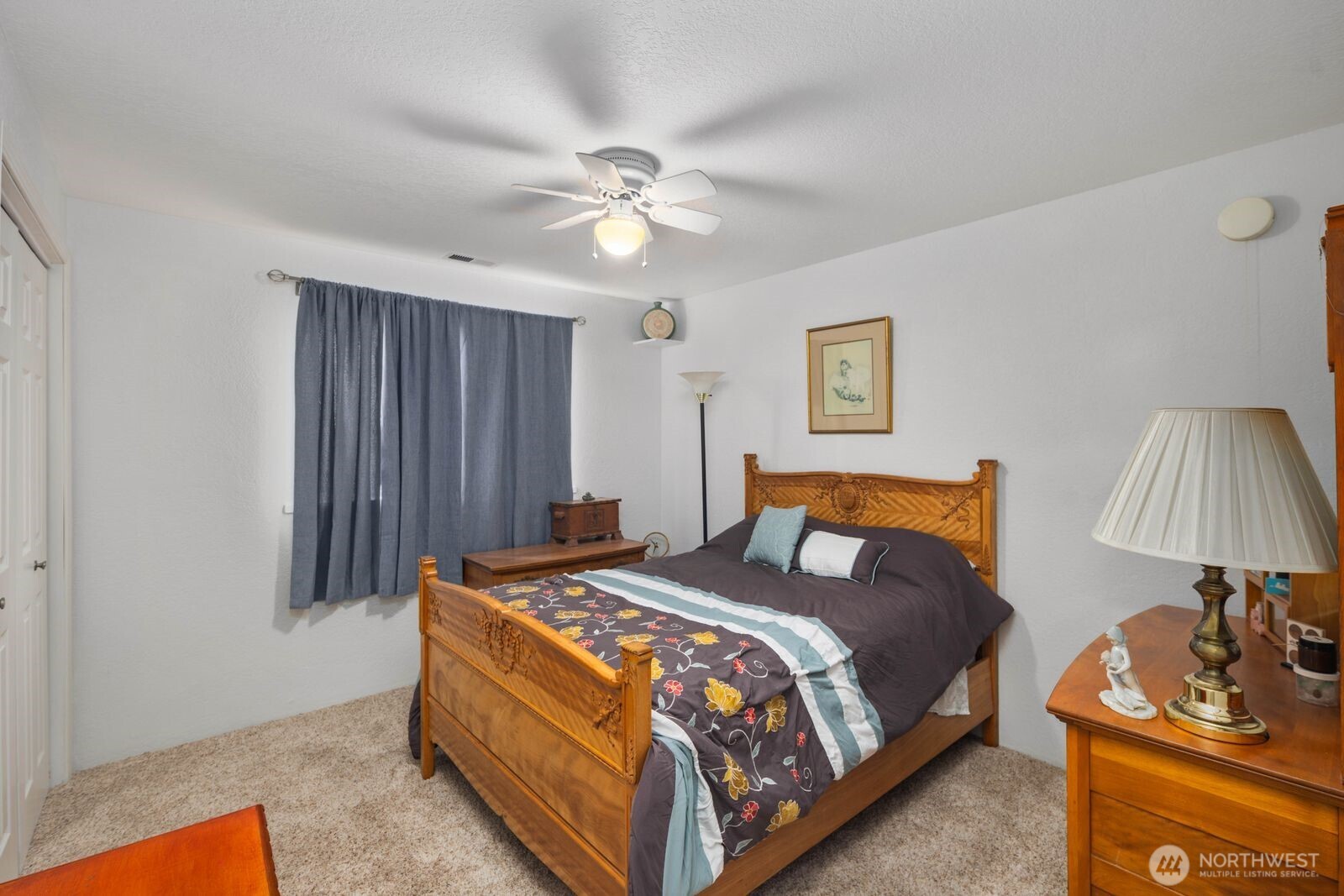 5874 Sherry Place Ferndale, WA 98248 - Photo 12 of 27 a bed room with a bed and a lamp