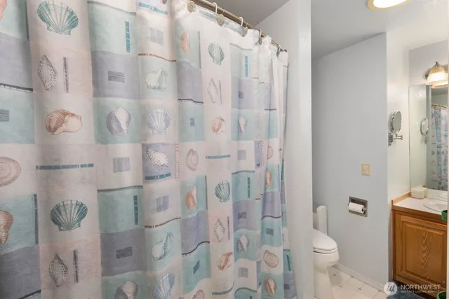 a bathroom with a shower curtain