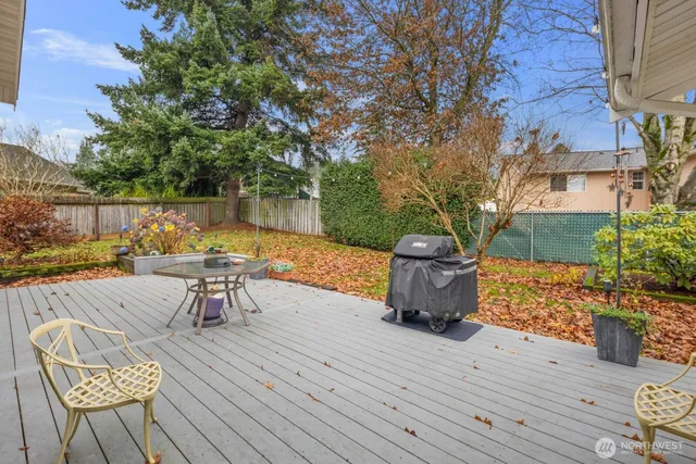 a view of a backyard with sitting area