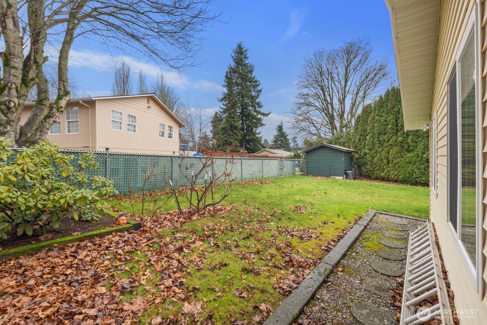 5874 Sherry Place Ferndale, WA 98248 - Photo 21 of 27 a view of a backyard with a garden