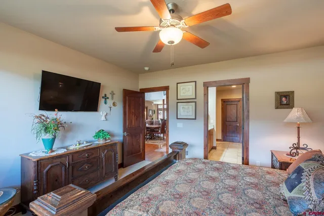 a spacious bathroom with a granite countertop sink and a mirror