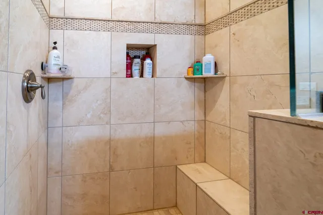 a view of a livingroom with workspace and a window