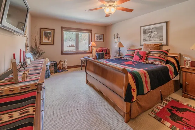 a bathroom with a toilet sink vanity and mirror