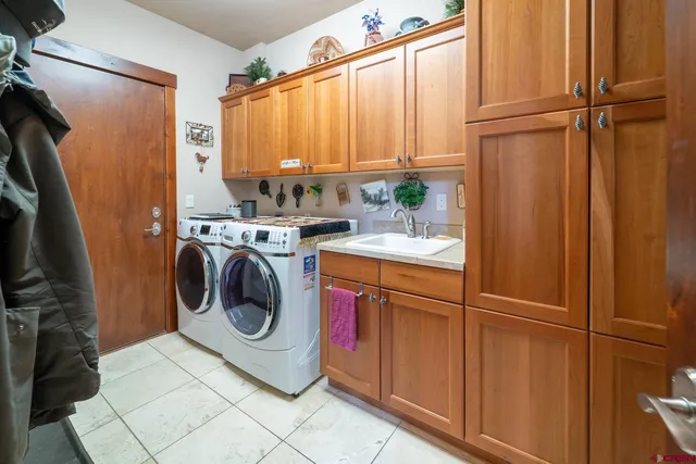 a front view of a house with a yard table and chairs