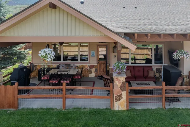 a view of a terrace with furniture and a patio