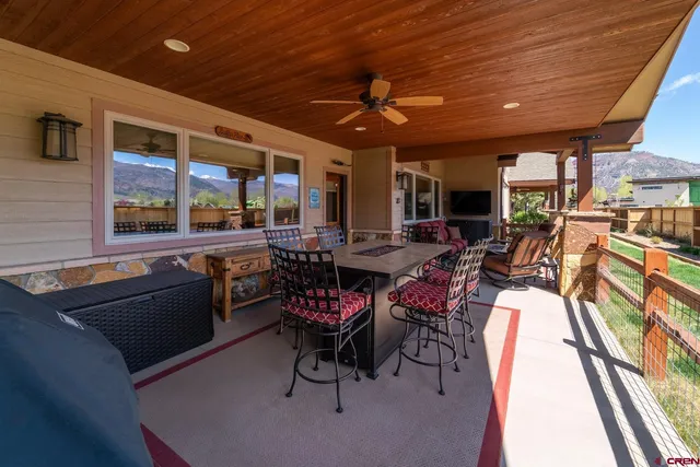 a outdoor living space with furniture and a fireplace