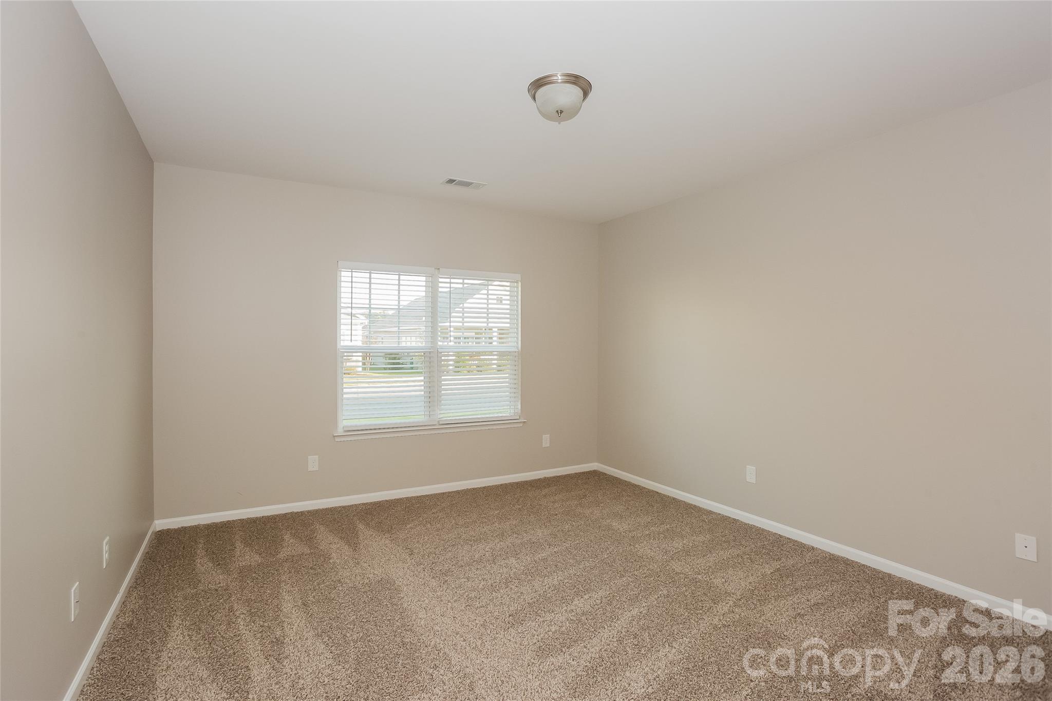 288 Harrison Lane Locust, NC 28097 - Photo 12 of 15 an empty room with a window