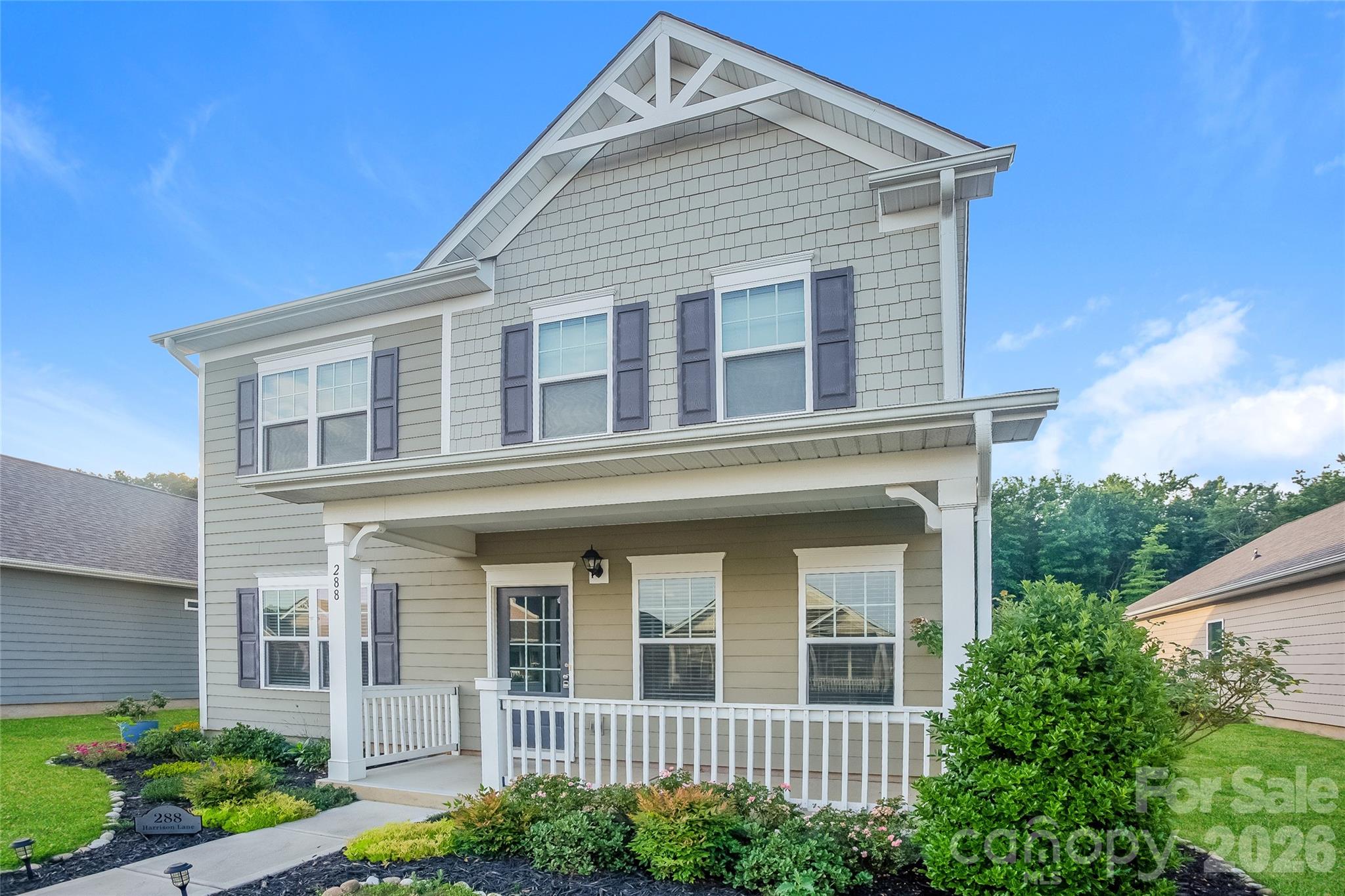288 Harrison Lane Locust, NC 28097 - Photo 2 of 15 a front view of a house with plants