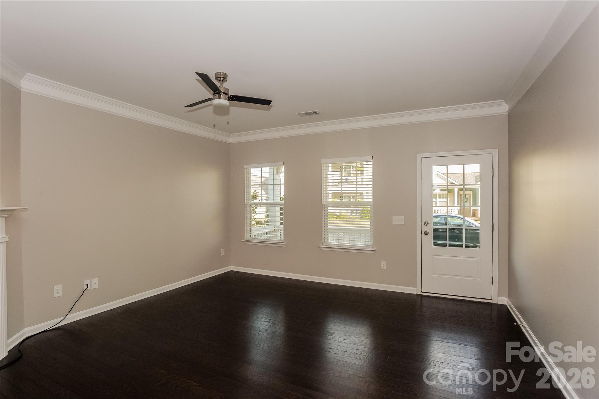 288 Harrison Lane Locust, NC 28097 - Photo 4 of 15 a view of an empty room with wooden floor and a window